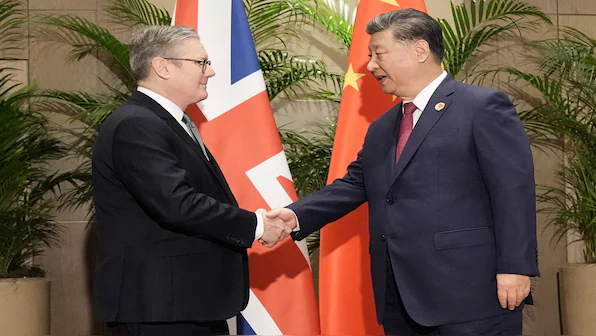 United Kingdom Prime Minister Keir Starmer shakes hands with President Xi Jinping of China