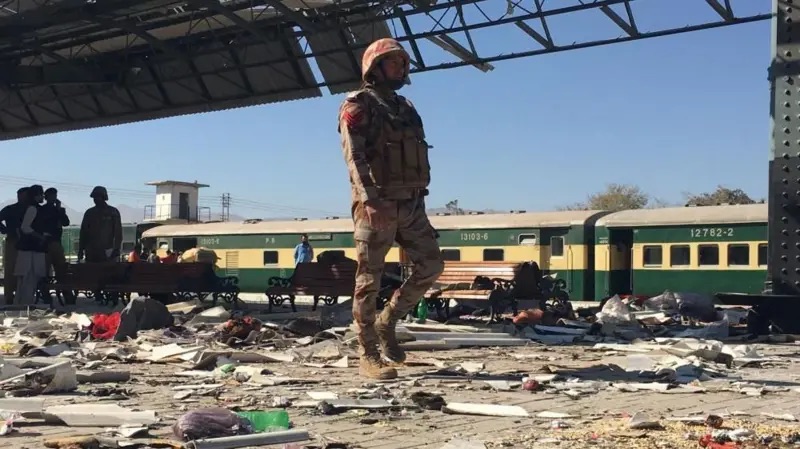 Pakistan Soldier Standing over the Rumbles of the Bomb Blast