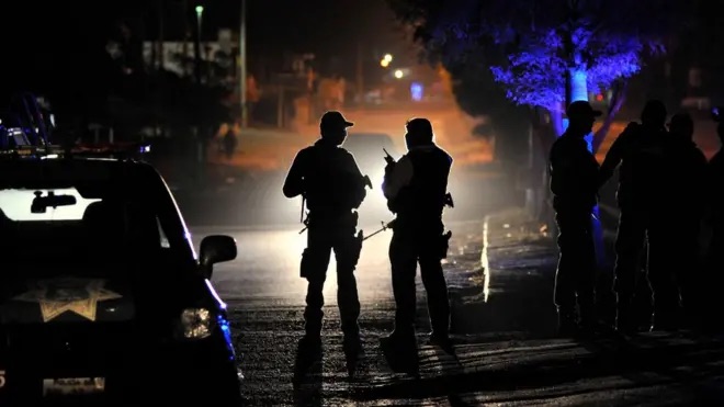 Two Mexican Police Officers at Scene of the Shootout