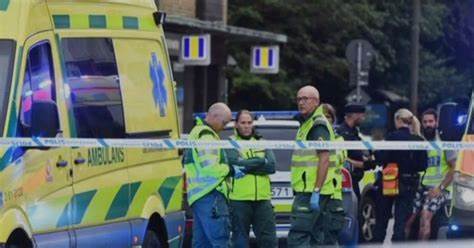 Police officers gathered at the front of education center in Orebon